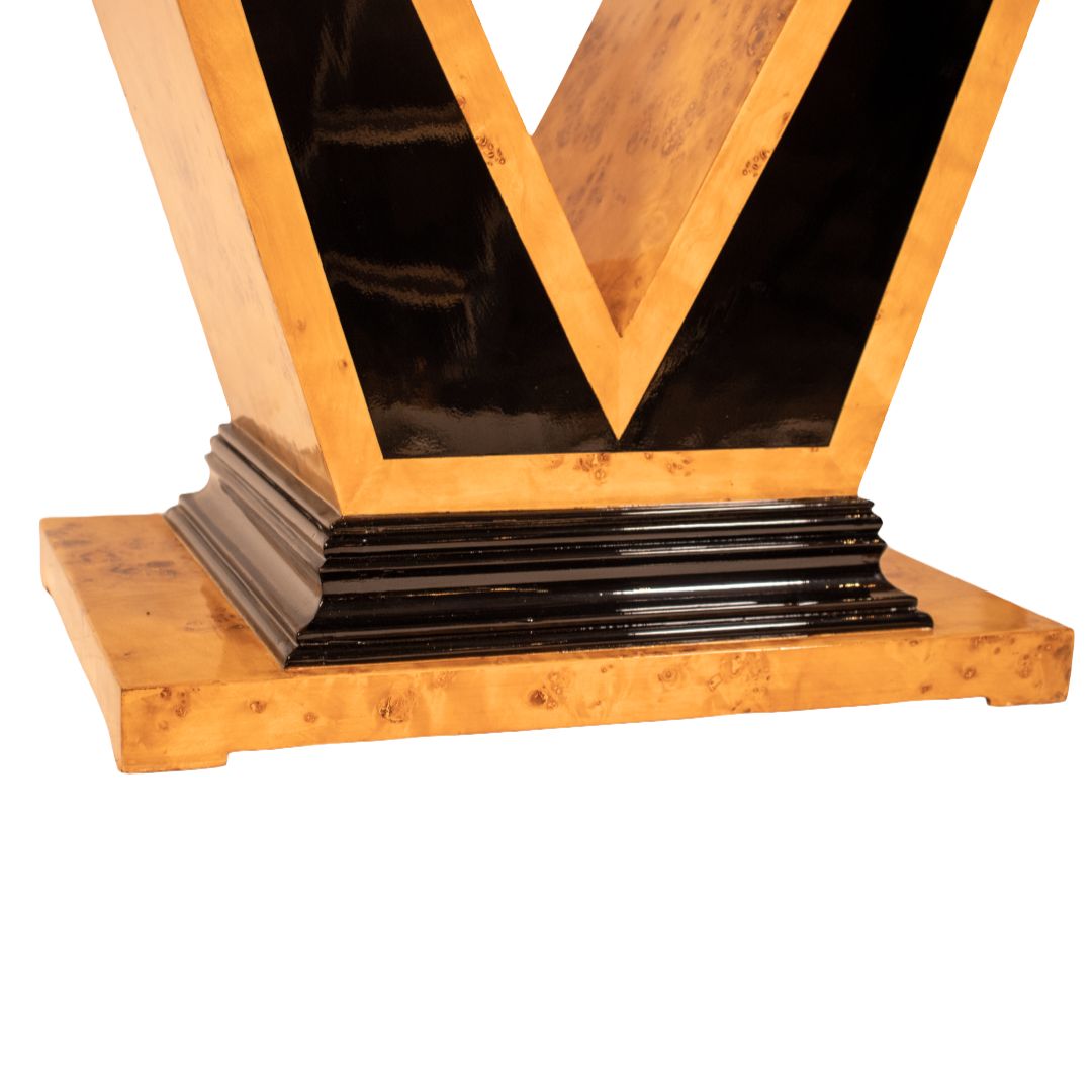 Close-up of the Art Deco V-shape console table base crafted from burl walnut wood with black lacquer detailing, sturdy decorative pedestal