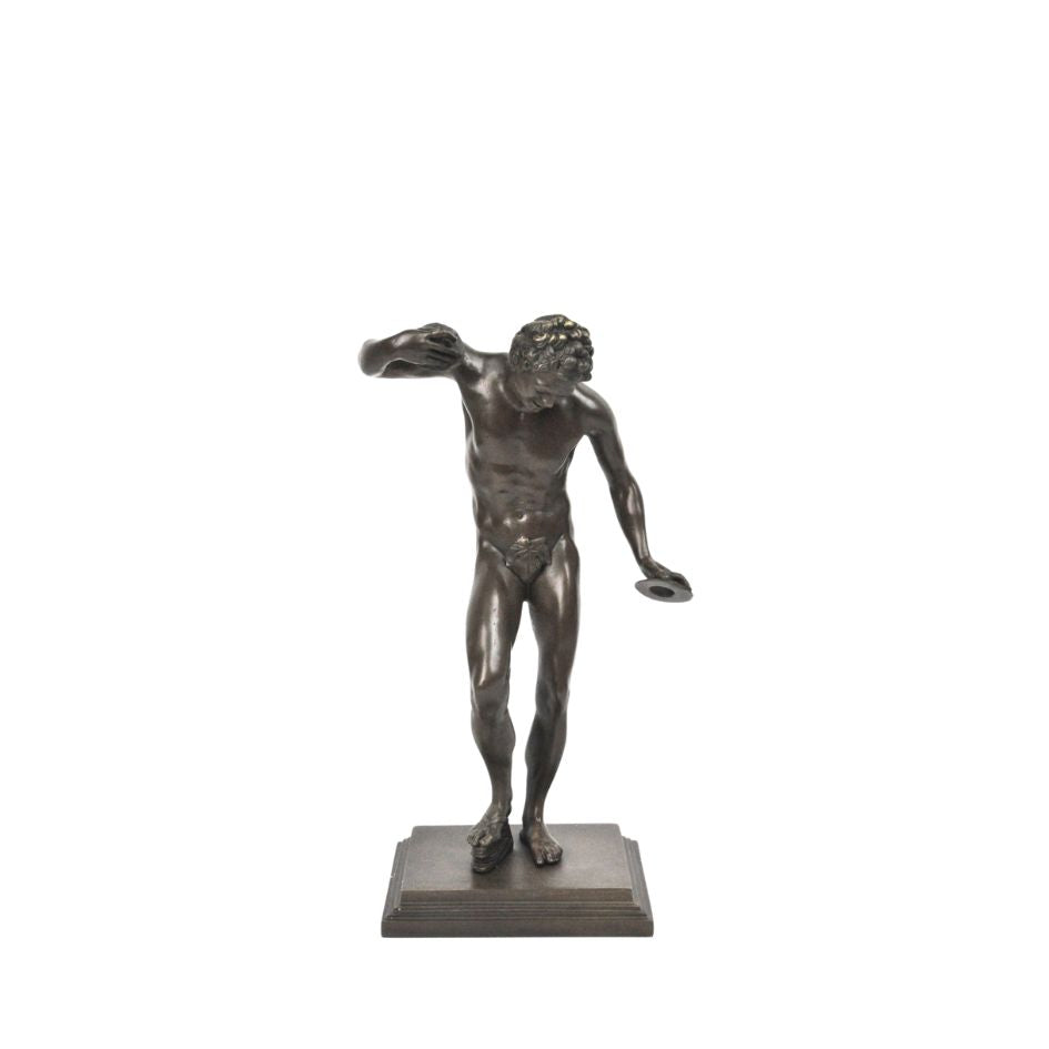Bronze sculpture of a dancing man in dynamic pose