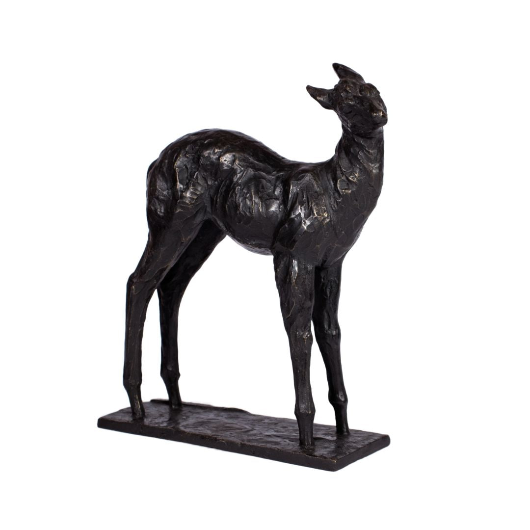 Bronze sculpture of a fawn deer with dark patina