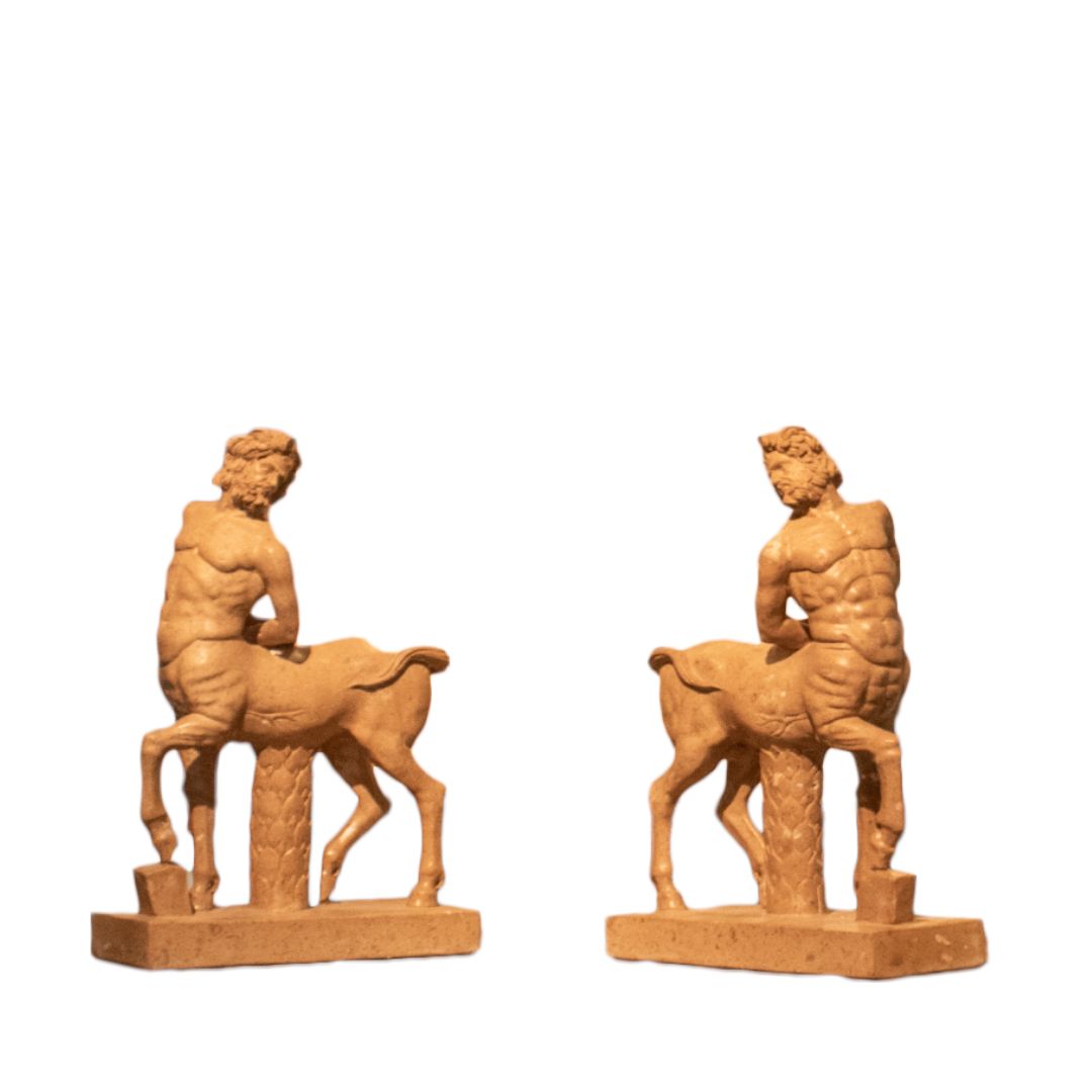 Hand-carved travertine marble sculptures of Borghese centaur figures on rectangular bases